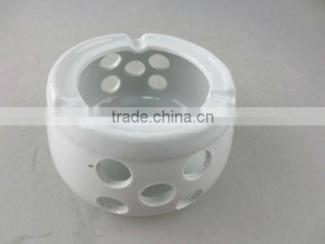 white round porcelain ashtray with holes