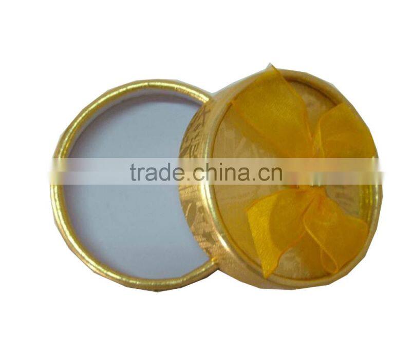gold round gift box with ribbon design