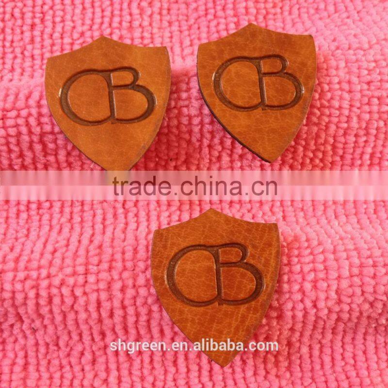 Soft debossed company name leather tags for suits