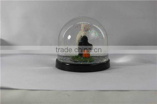 Plastic pumpkin halloween snow globe