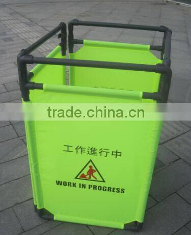 green fabric folding traffic fence