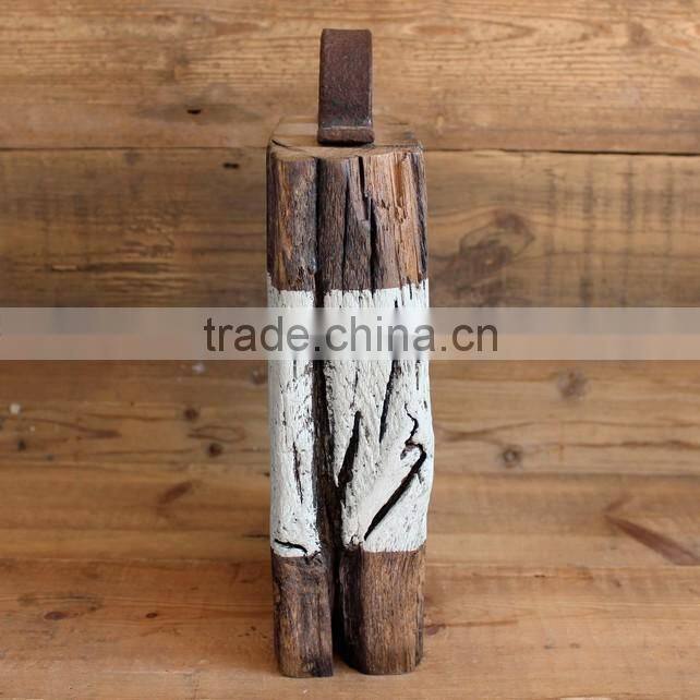 older aged wooden door stop