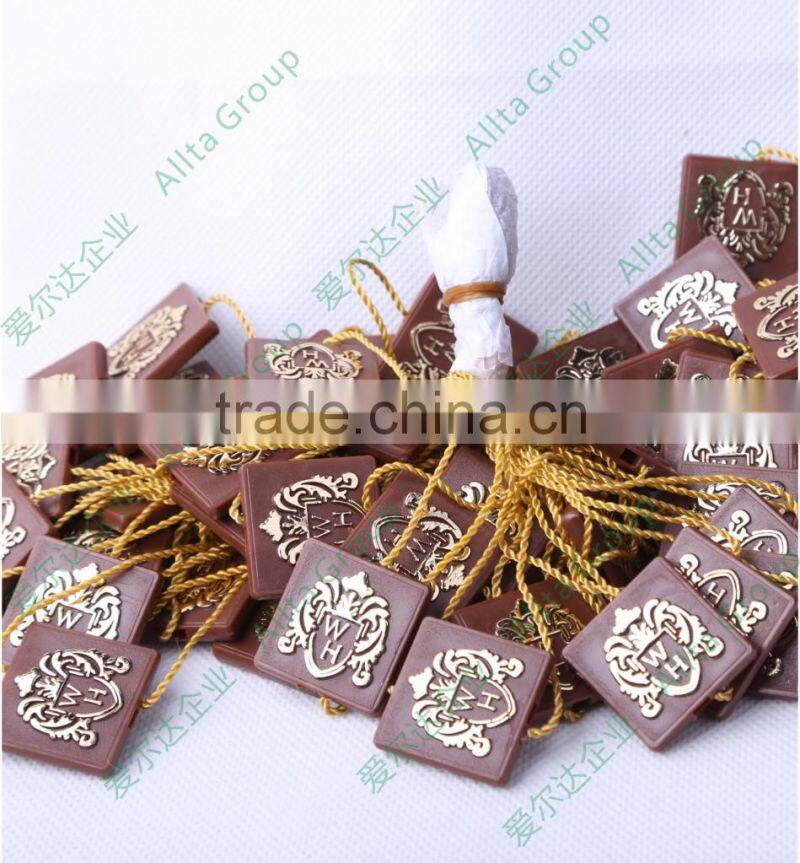 Custom plastic embossing seal tag for garment