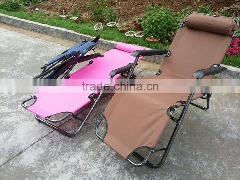 Folding lounge with foot rest and pillow