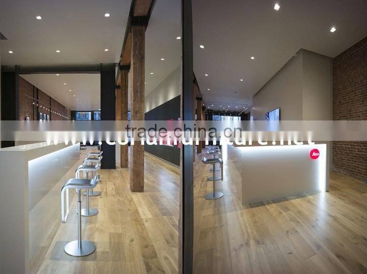 Hi Macs / Corian solid surface made center cashier desk for optical store design