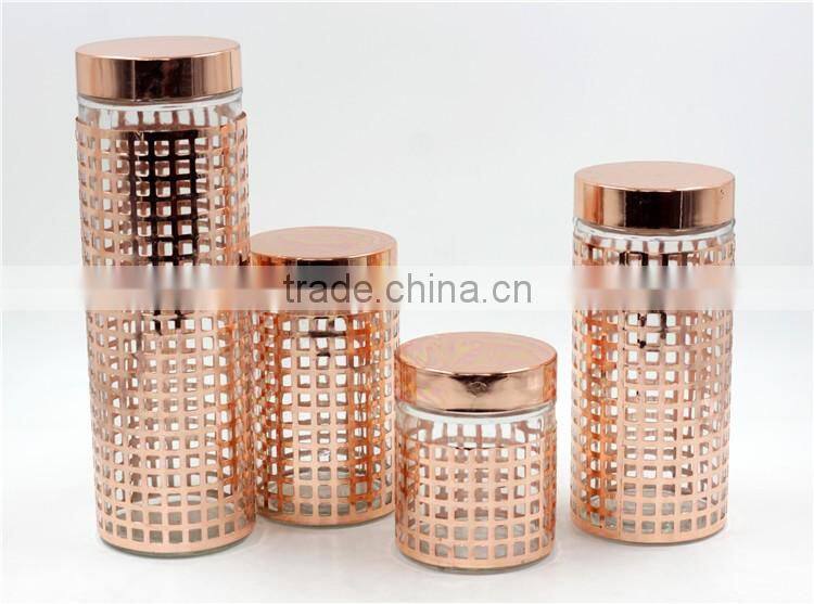 glass canister with gold embossing metal cover