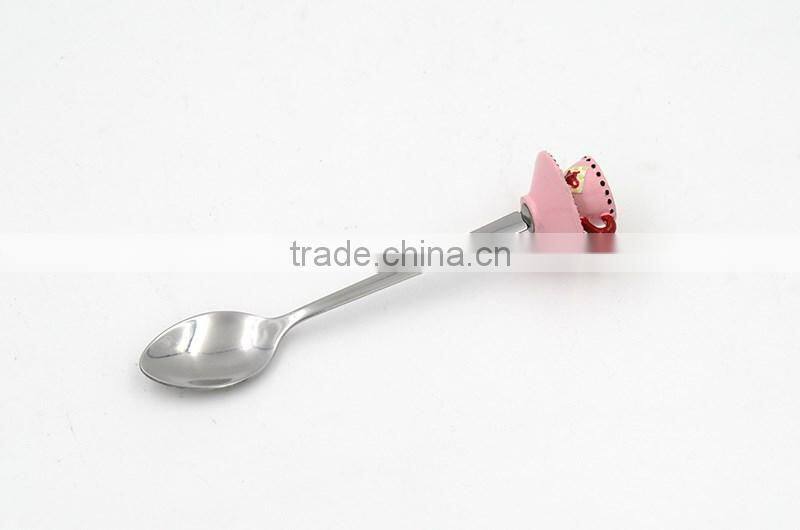 Green colored tea cup handle cake spoon