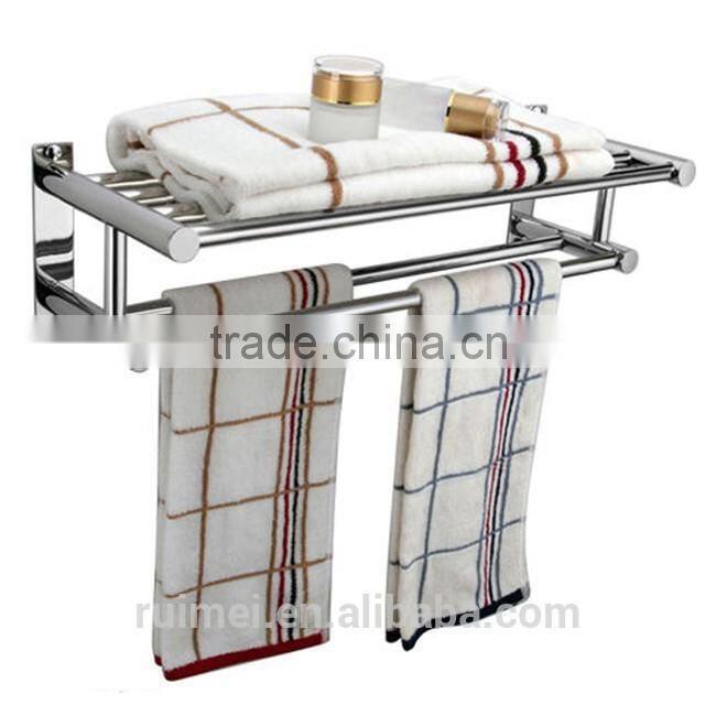 Stainless steel wall with folding towel rack