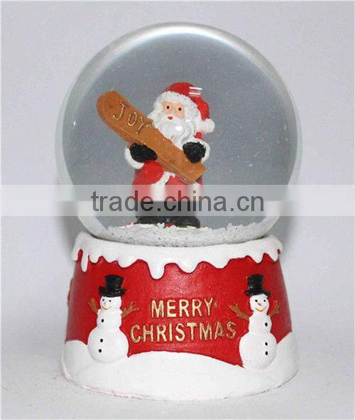 Resin santa snow globe with blowing snow