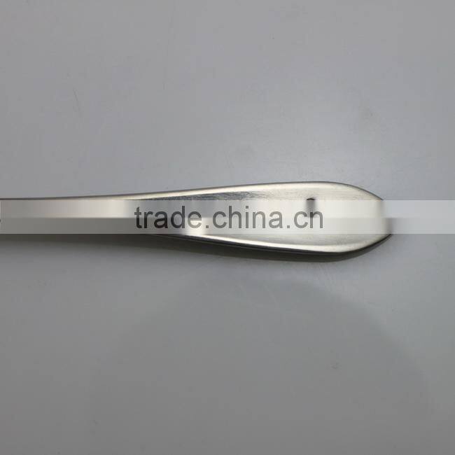Laser engraving small stainless steel dessert spoon in blister card