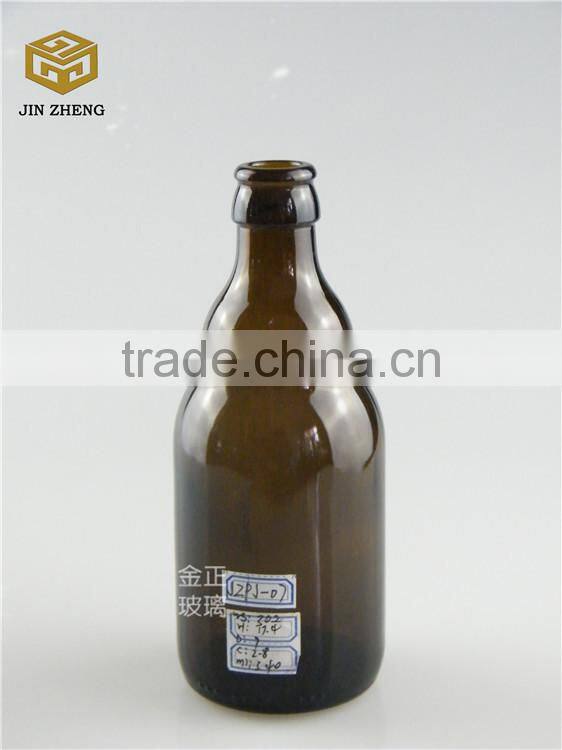 330ml dark amber open beer bottle with fridge magnet