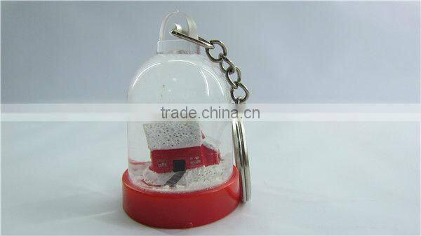 Plastic snow globe penguin key chain