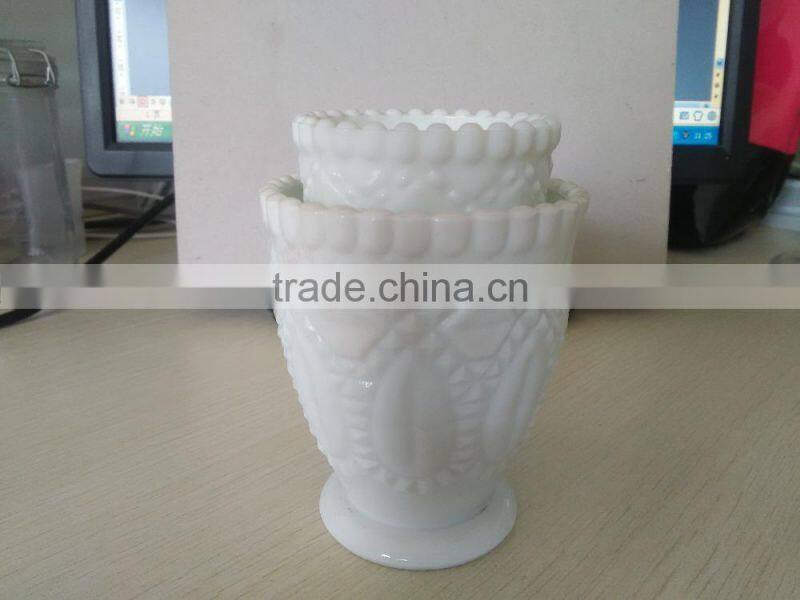 white cup shape candle jar