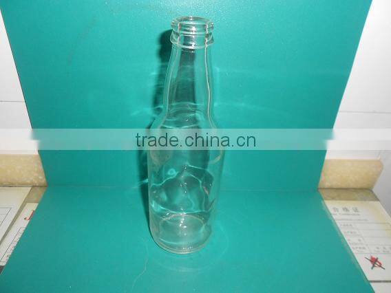 clear glass mineral water bottle with crown