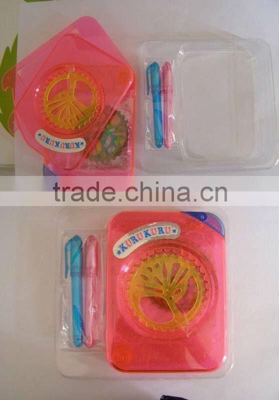 plastic spirograph toys with papers