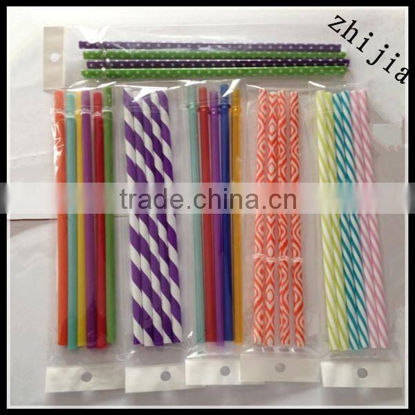Clear wrapped red plastic drinking straw