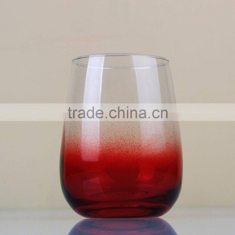 Red bottom stemless wine glass