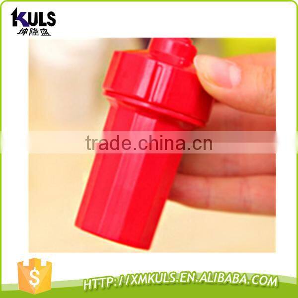 Small plastic tool for mashing garlic