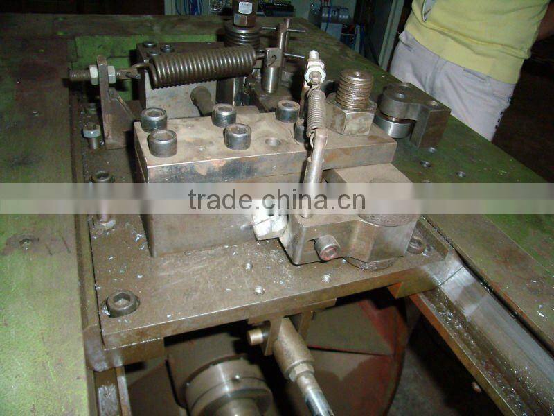 combined drawing machine- cam shear