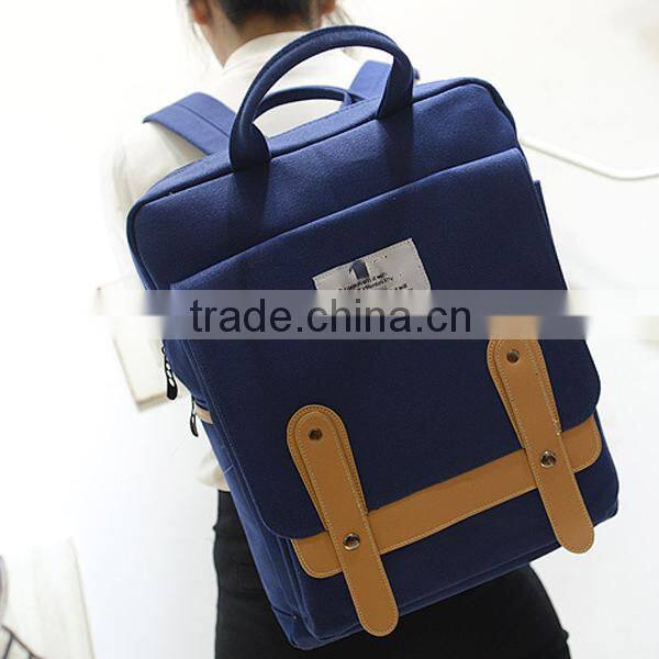 blue canvas travel backpack with laptop compartment