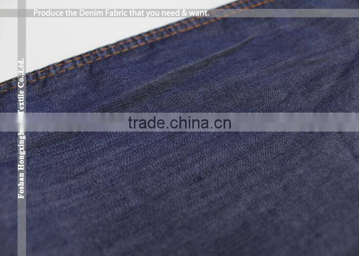 Wholesale large quantity supplier Plain pure 100% Tencel cotton denim fabric for jean garment