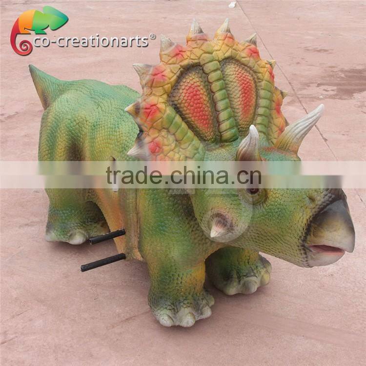 Funfair coin operated kiddie dinosaur rides