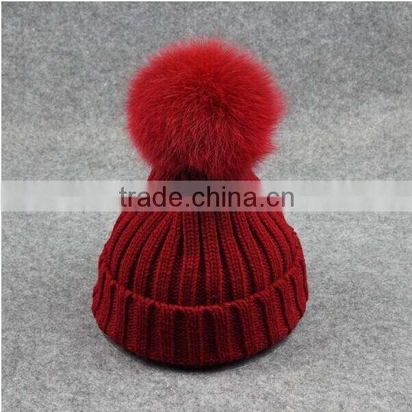 Free sample custom pom pom beanie hats wholesale with faux fur pom