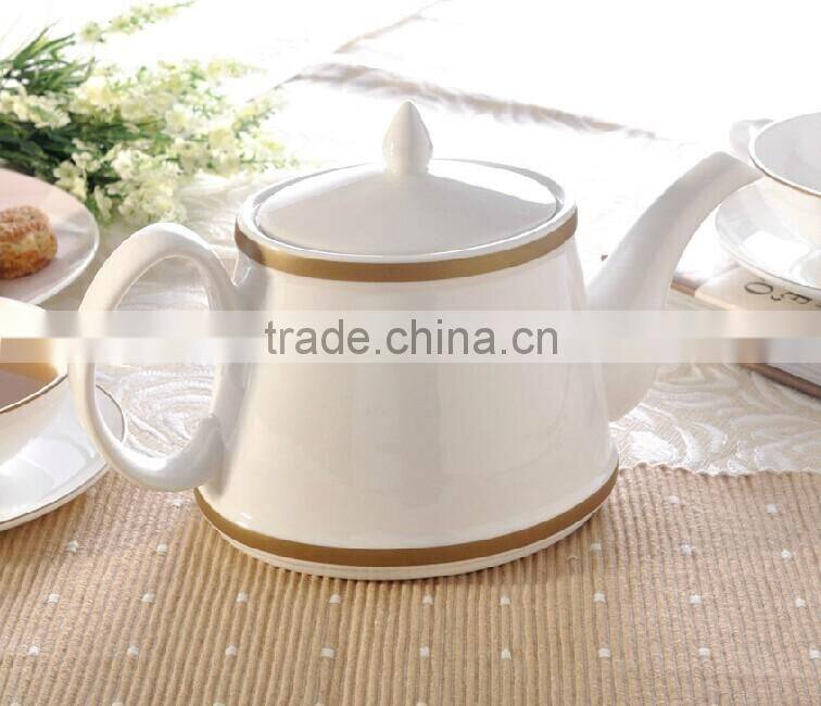 white porcelain ceramic tea pot with color line