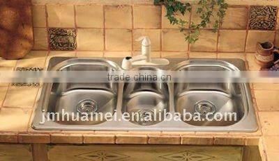 Stainless steel kitchen sink with waste bin