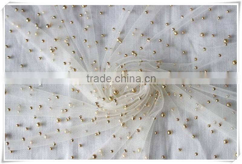 New arrival Transparent tulle soft beige net fabric with gold beads for Girl's dress