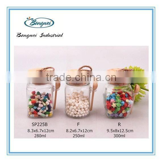 glass spice jar with wooden lid and spoon