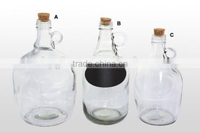big glass bottle with wooden lid and mini handle
