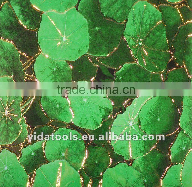 Green leaves with golden edge ceramic tile
