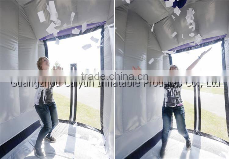 Inflatable cash machine catching money game