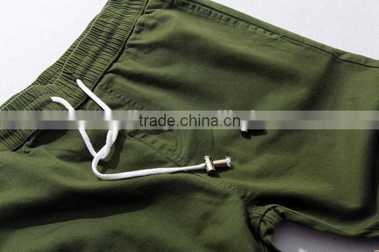 Mens green pocket inside hem zipper woven fashion pants