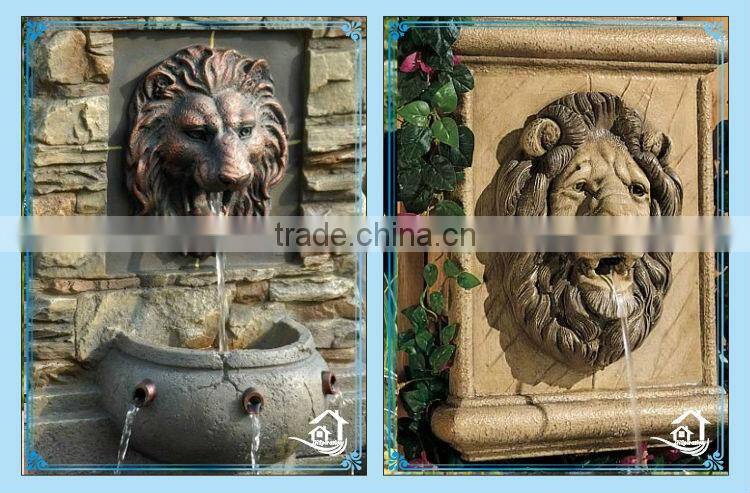Stone lion head water fountain