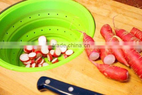 wooden cutting board with collapsible colander