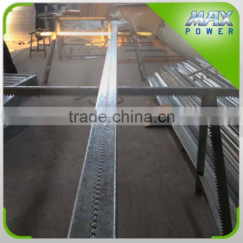 Greenhouse sun shade rack and pinion system