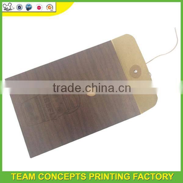 Kraft envelope with button and string closure