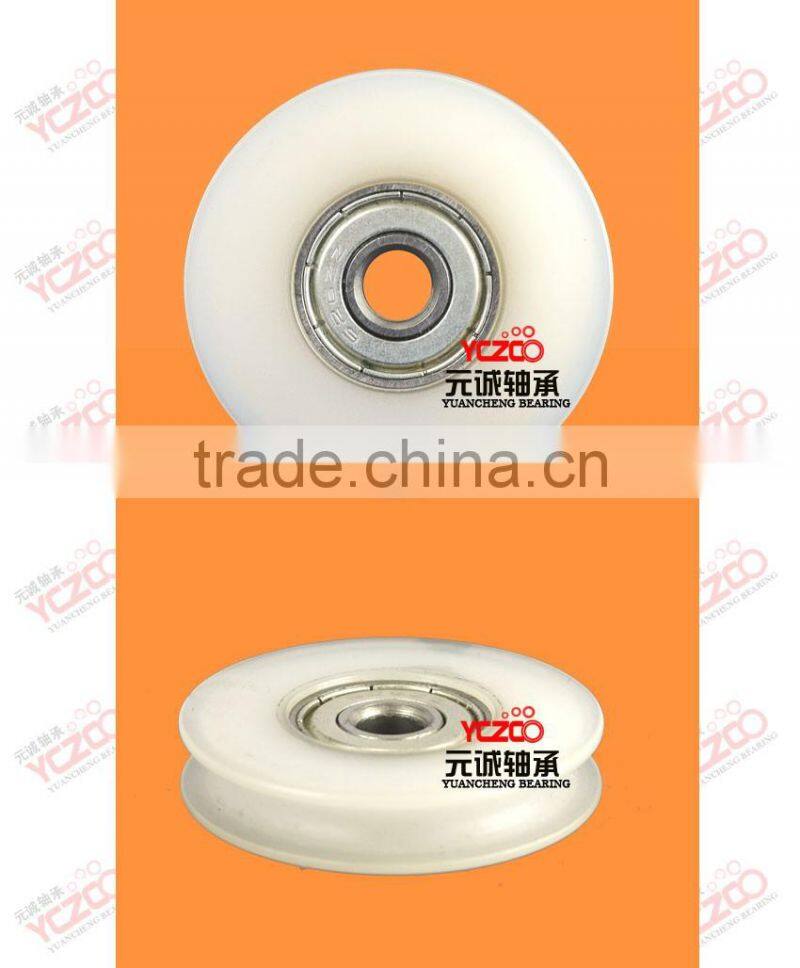 Low friction gate door roller with nylon