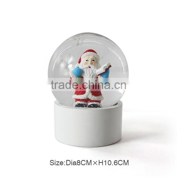 Stable christmas santa plastic snow globe