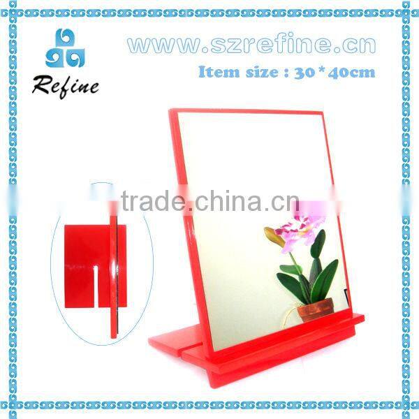 unframed small standing table mirror