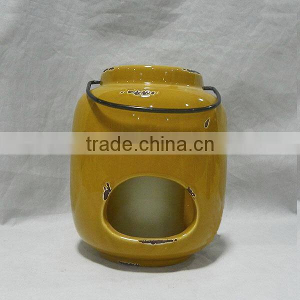 Yellowish brown ceramic storm lantern