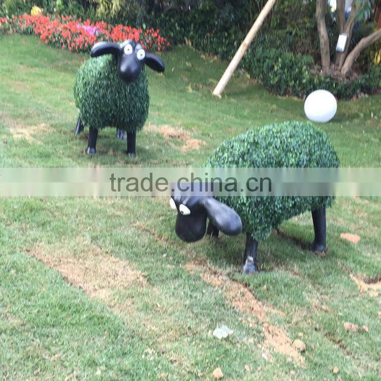 Fiberglass goat statue with artificial grass
