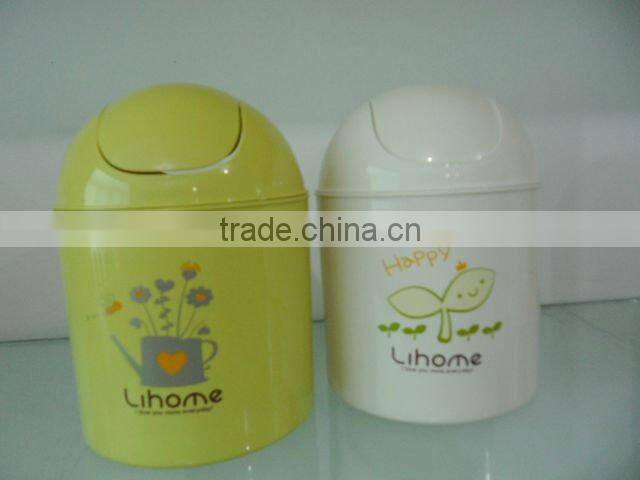 Round swing-top plastic trash can