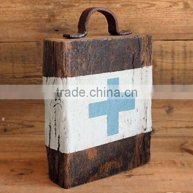 older aged wooden door stop
