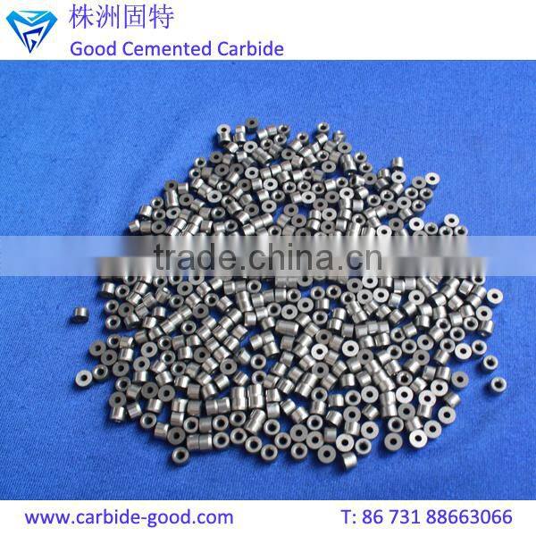 Discharge valve seat made from tungsten carbide