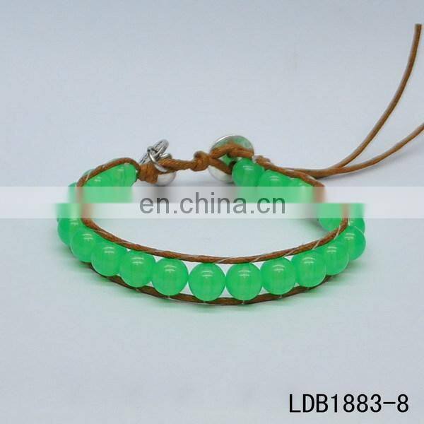 Handmade beaded wrap bracelet features 3 rows of circular and square stones surrounded by a natural colored cord on both sides