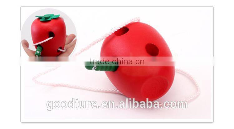 Wooden Caterpillar Eating Red Apple