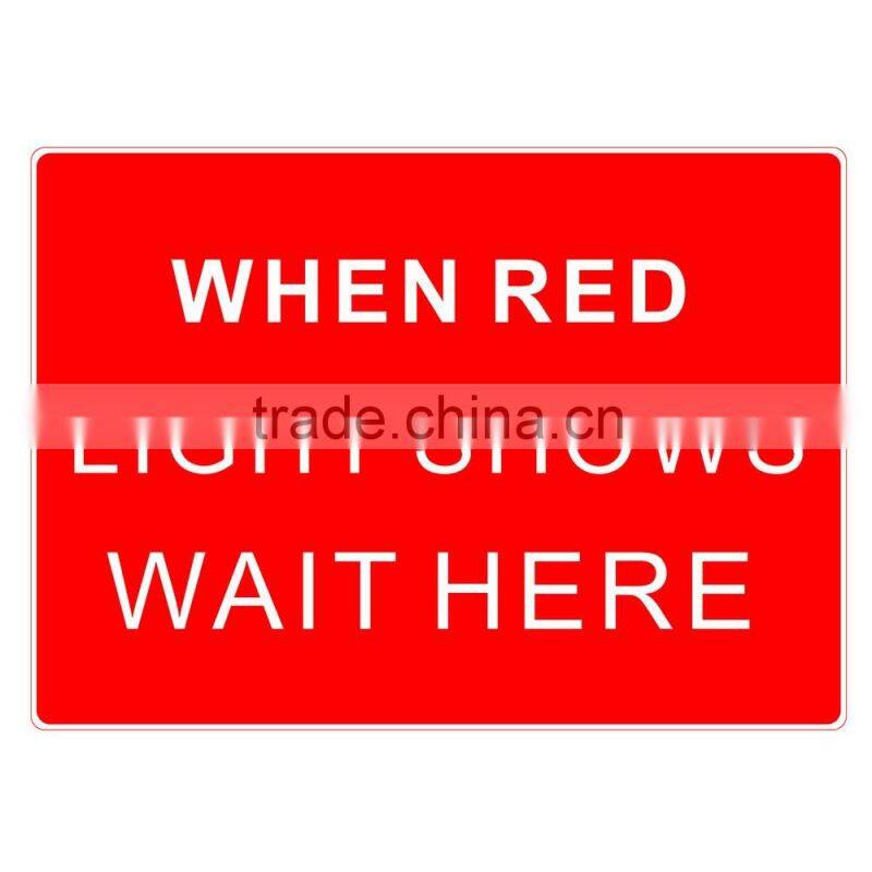 Reflective adhesive When red light shows wait here traffic sign